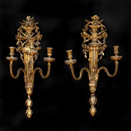 Appraisal: PAIR OF LOUIS XVI-STYLE CARVED GILTWOOD THREE-LIGHT WALL APPLIQUES Each