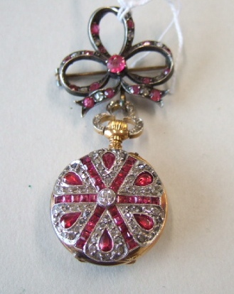 Appraisal: A ladies ruby and diamond set keyless wind openfaced pendant