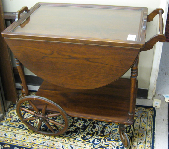 Appraisal: WALNUT DROP-LEAF SERVING CART American c 's The rectangular cart