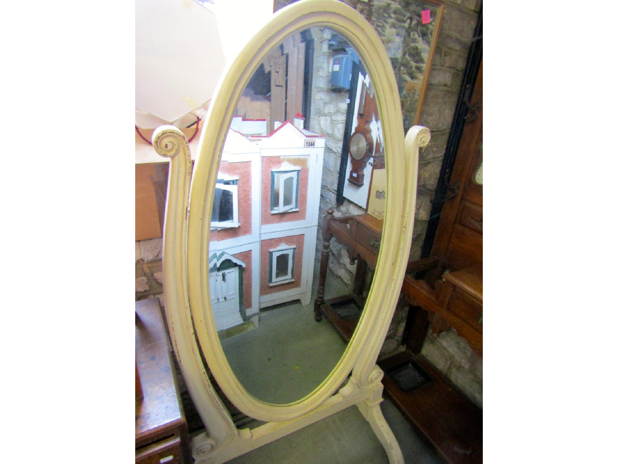 Appraisal: A Regency style cheval mirror of oval form with moulded