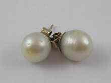 Appraisal: A pair of large cultured pearl ear studs each pearl