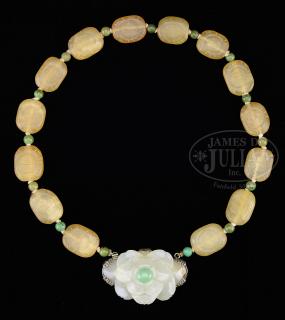 Appraisal: CARVED JADE AND HARD STONE NECKLACE CARVED JADE AND HARD