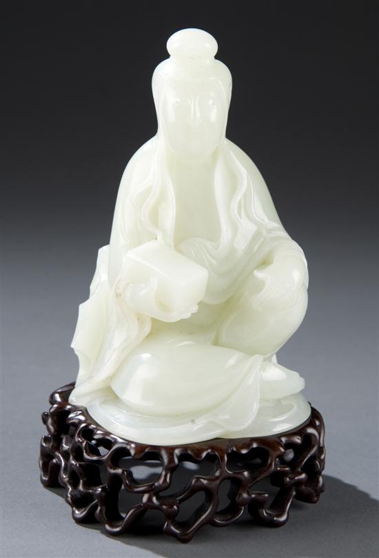 Appraisal: Chinese celadon jade carving of a seated Guanyin Presented on