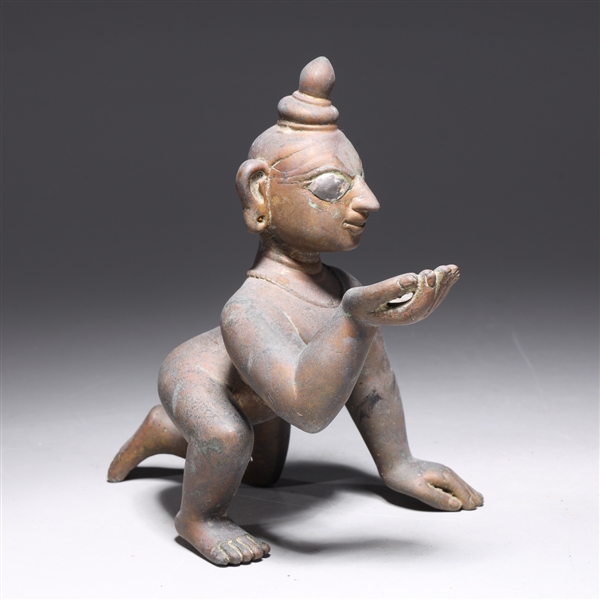 Appraisal: Antique Indian bronze crawling Krishna statue with some remaining enamel