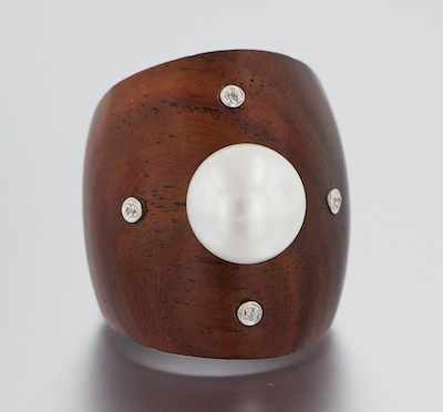 Appraisal: A Carved Mahogany Pearl and Diamond Ring Carved mahogany ring