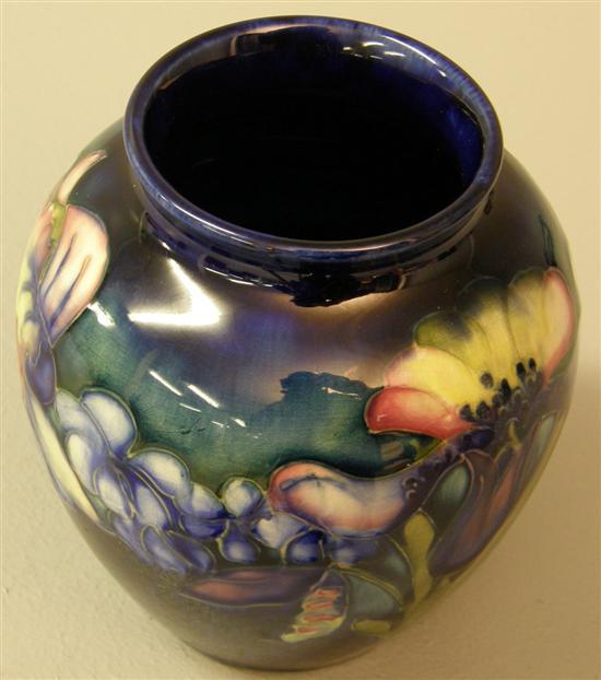 Appraisal: Moorcroft vase of ovoid form decorated with Irises and other