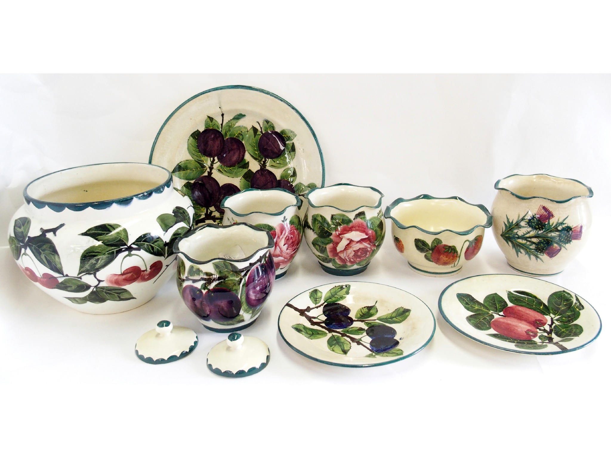 Appraisal: Three Wemyss cache pots plate and other Weymss-style table ornaments