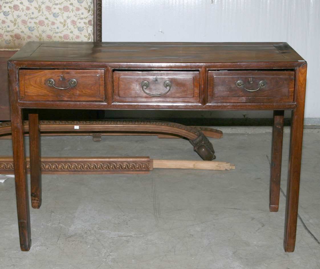 Appraisal: CHINESE CARVED HARDWOOD WRITING TABLE The rectangular top above a