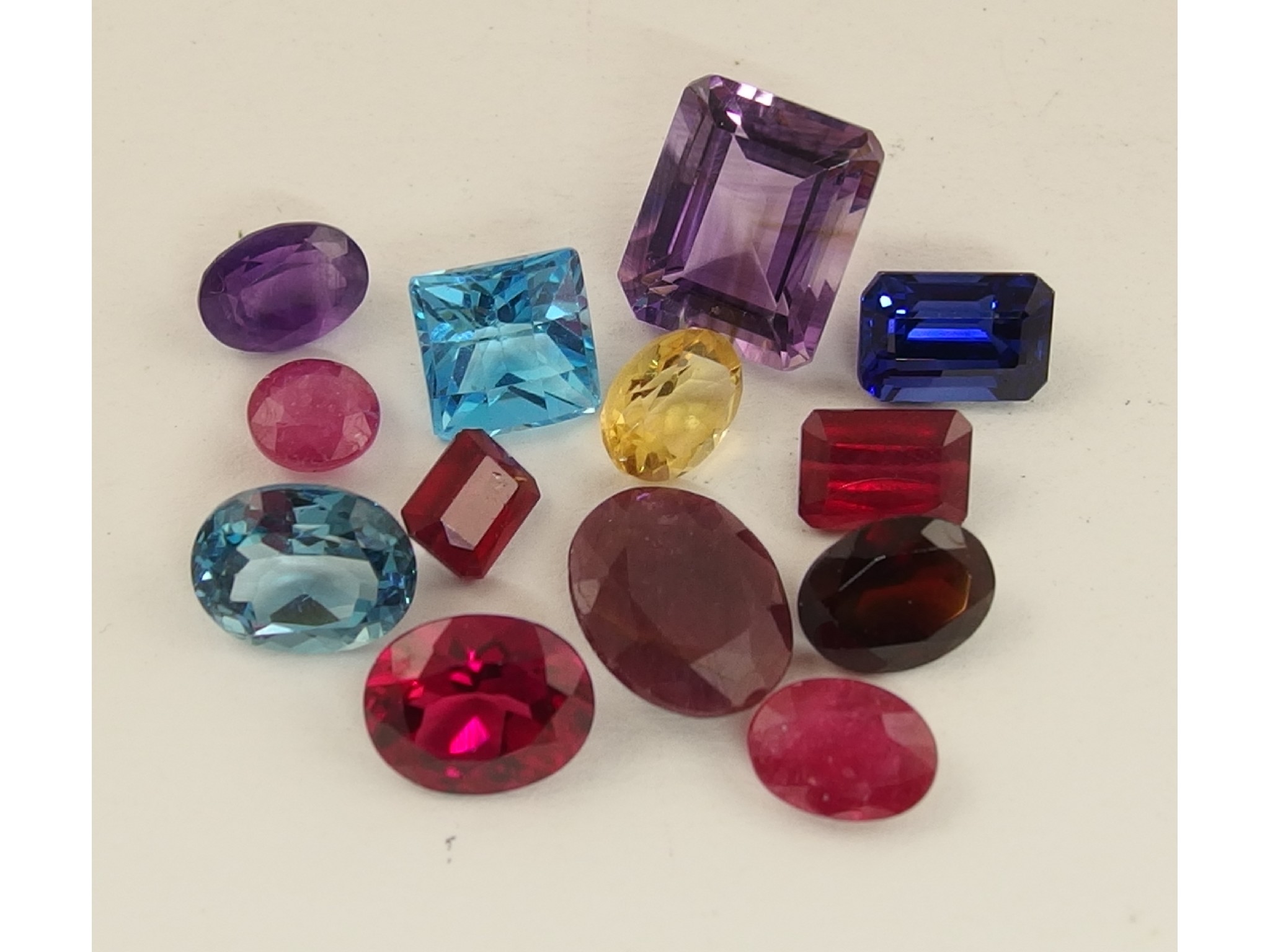 Appraisal: A collection of gemstones to include citrine amethyst garnet etc