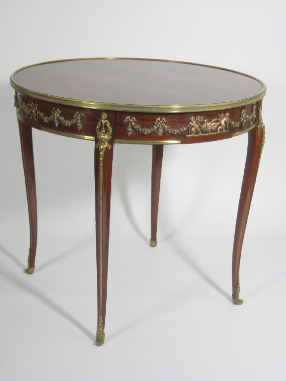 Appraisal: A French Kingwood circular Centre Table with segmented inlaid top