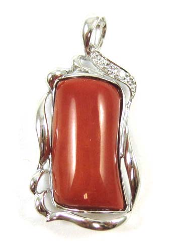 Appraisal: CORAL DIAMOND AND FOURTEEN KARAT WHITE GOLD PENDANT set with