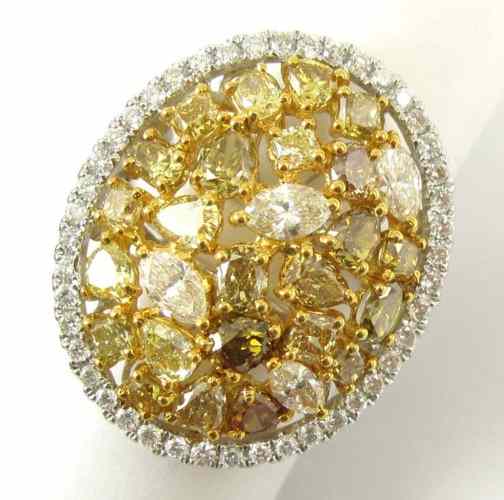 Appraisal: DIAMOND AND FOURTEEN KARAT GOLD RING set with round oval