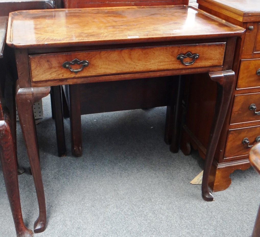 Appraisal: A George III mahogany silver table the dished rectangular top