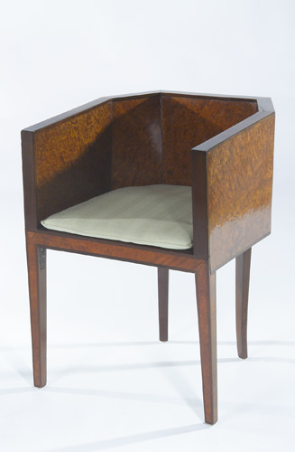 Appraisal: EUROPEAN ART DECO Faceted lounge chair with burlwood veneer and