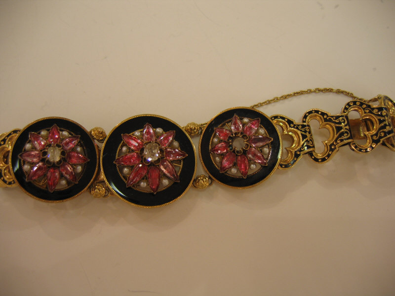 Appraisal: ENAMEL AND DIAMOND BRACELET Black enamel center circles set with