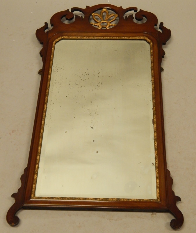 Appraisal: A mahogany fret framed wall mirror with parcel gilt decoration