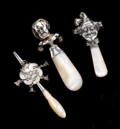 Appraisal: Three figural sterling silver and mother of pearl rattles various