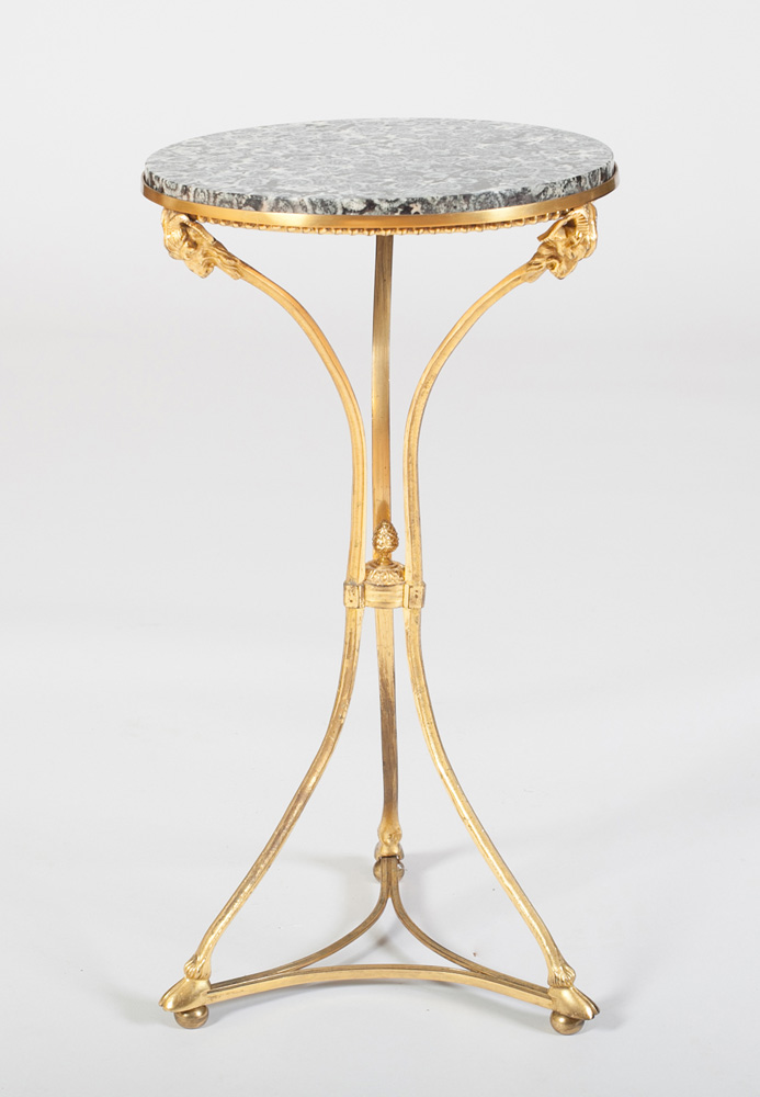 Appraisal: DIRECTOIRE STYLE ORMOLU GU RIDON With an inset fossilized marble