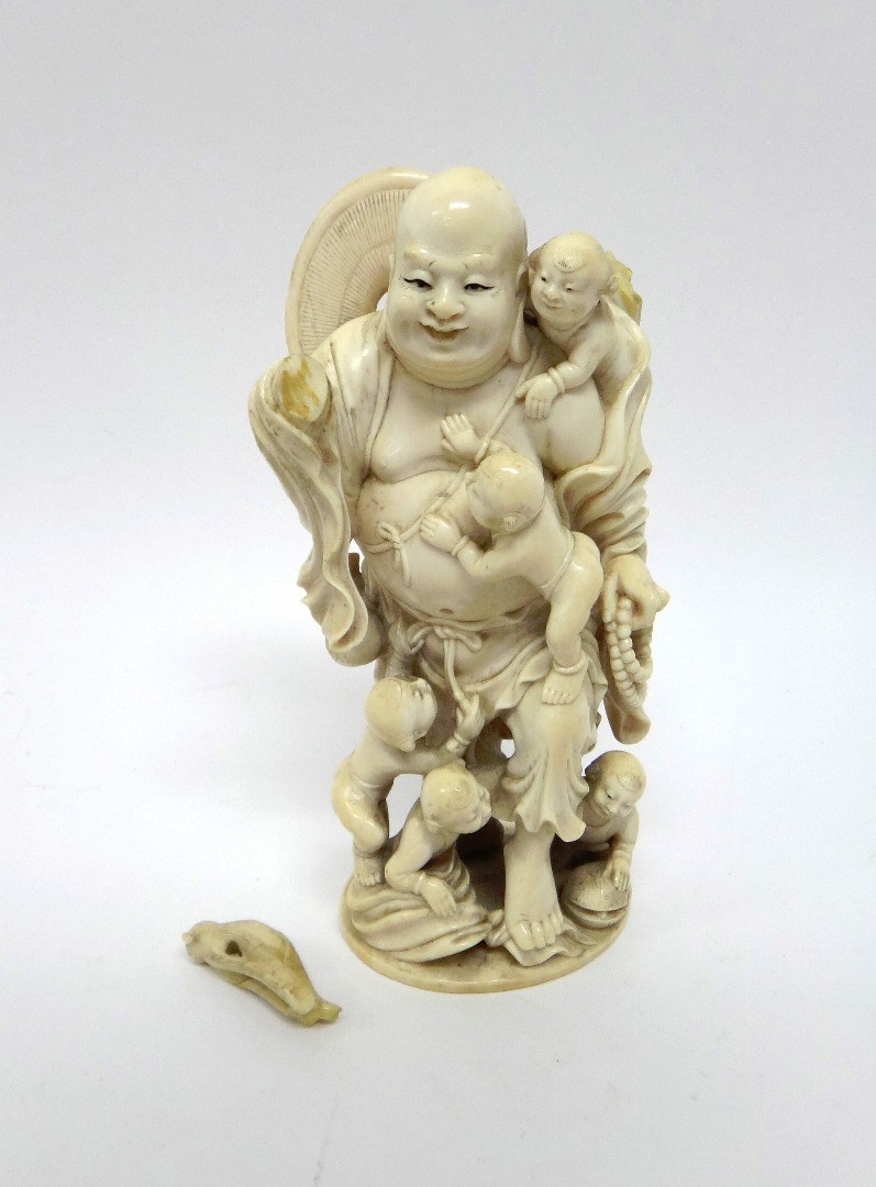 Appraisal: A Japanese ivory okimono of Hotei Meiji period the smiling