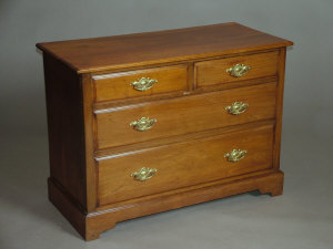 Appraisal: An Edwardian mahogany chest of two short and two long