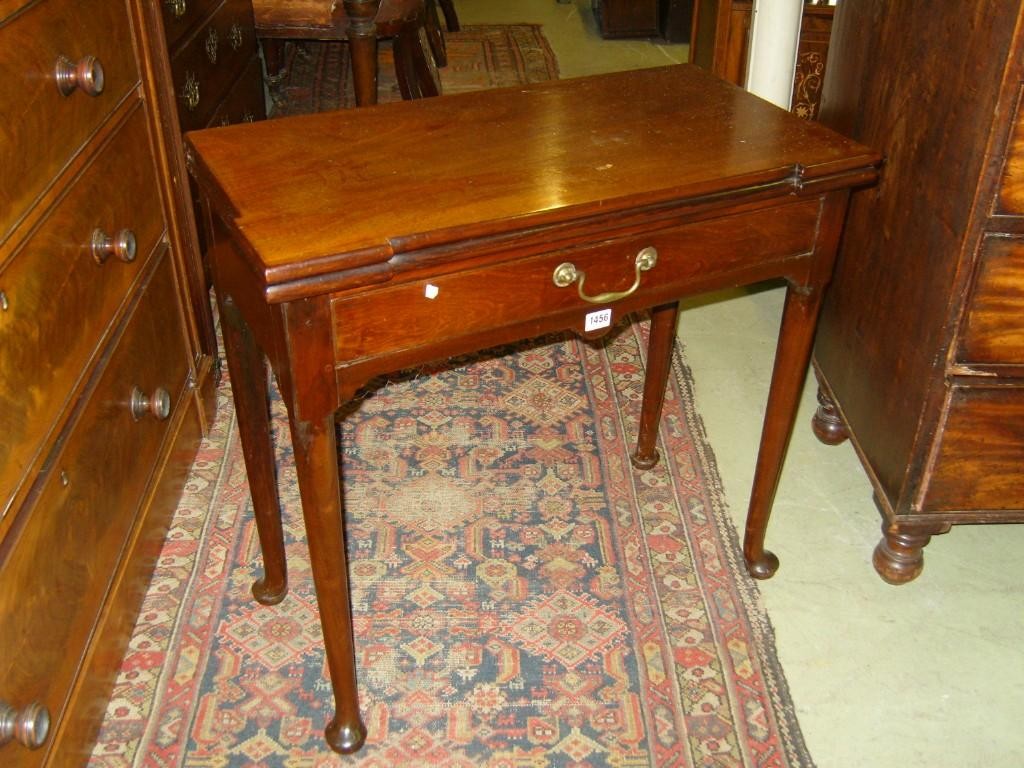 Appraisal: A Georgian mahogany fold over top games table with turret