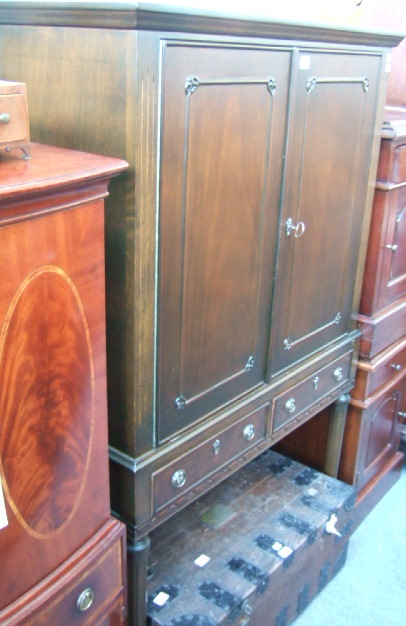 Appraisal: A th century mahogany cocktail cabinet the cupboard enclosing three