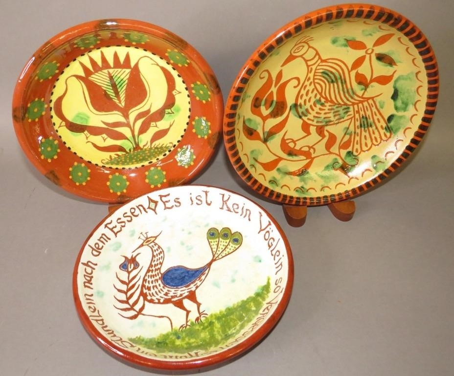 Appraisal: FOLK ART REDWARE DECORATED PLATES BY JAMES C SEca mid-late