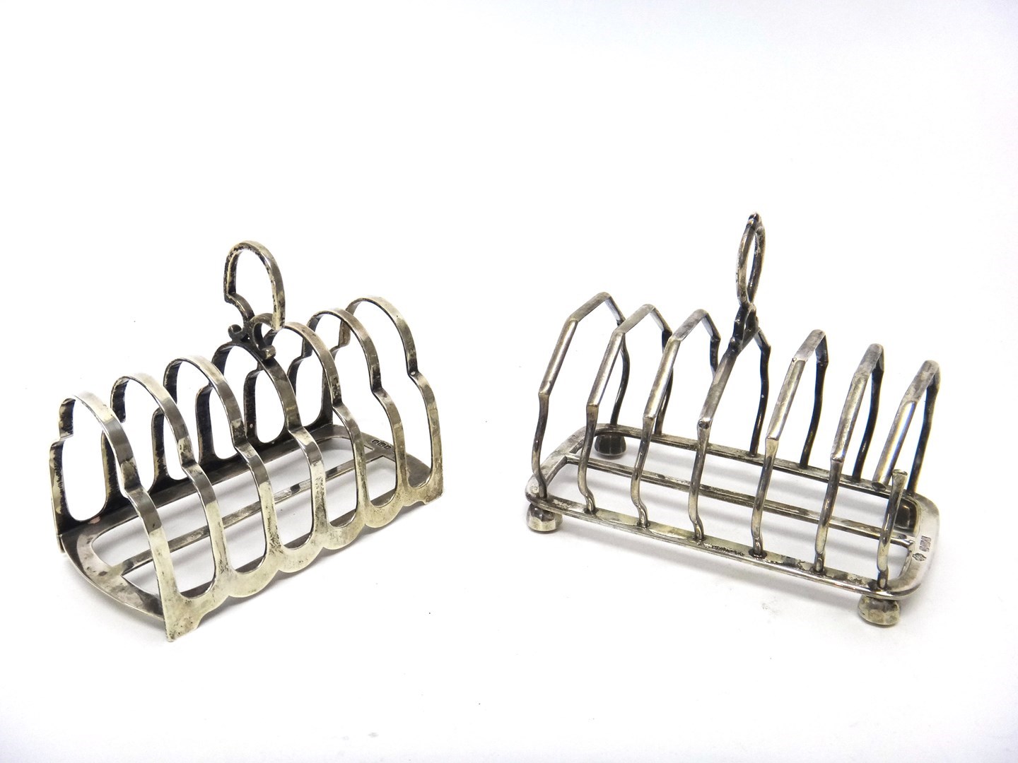 Appraisal: A silver seven bar toastrack in an angular design raised