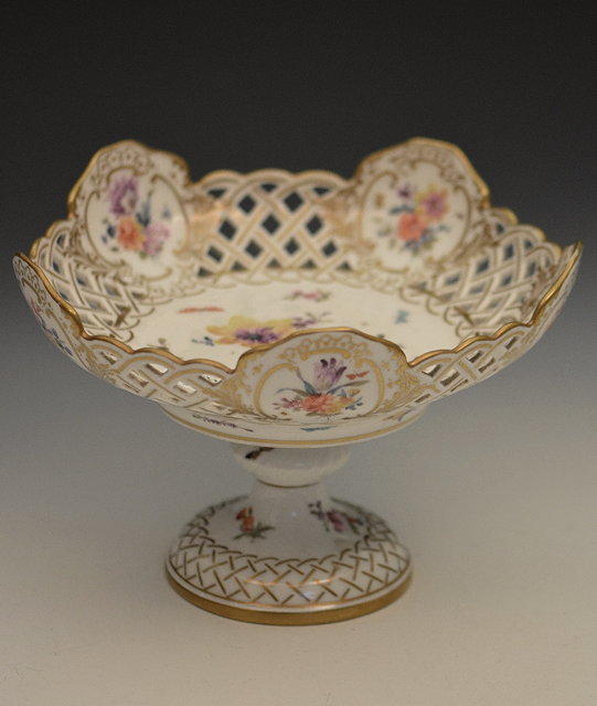 Appraisal: A Copenhagen white ground porcelain comportwith pierced top painted with