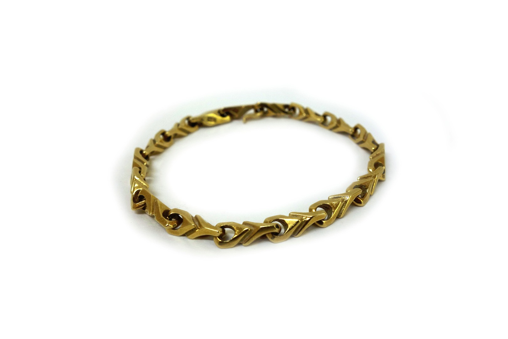 Appraisal: A heavy gold fancy curb-link bracelet detailed K hook clasp