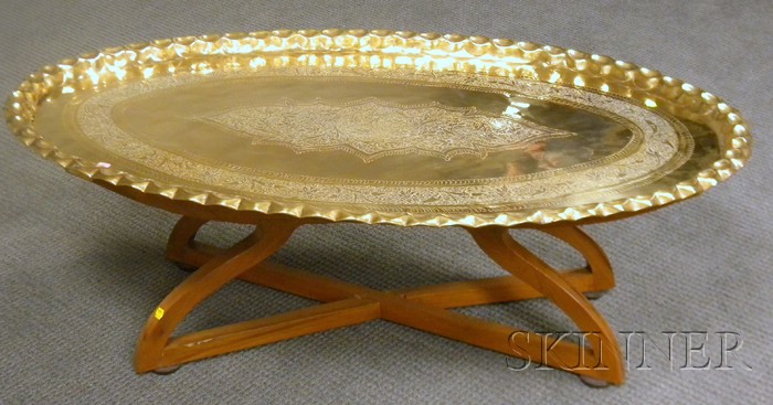 Appraisal: Large Indian Oval Brass Tray on Folding Wooden Stand tray