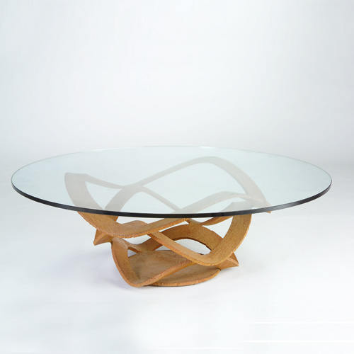 Appraisal: MODERN Coffee table with a metal ribbon base with serrated