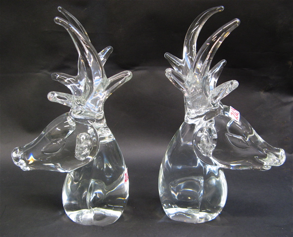 Appraisal: TWO SIGNED SWEDISH GLASS HORNED REINDEER HEADS molded clear glass