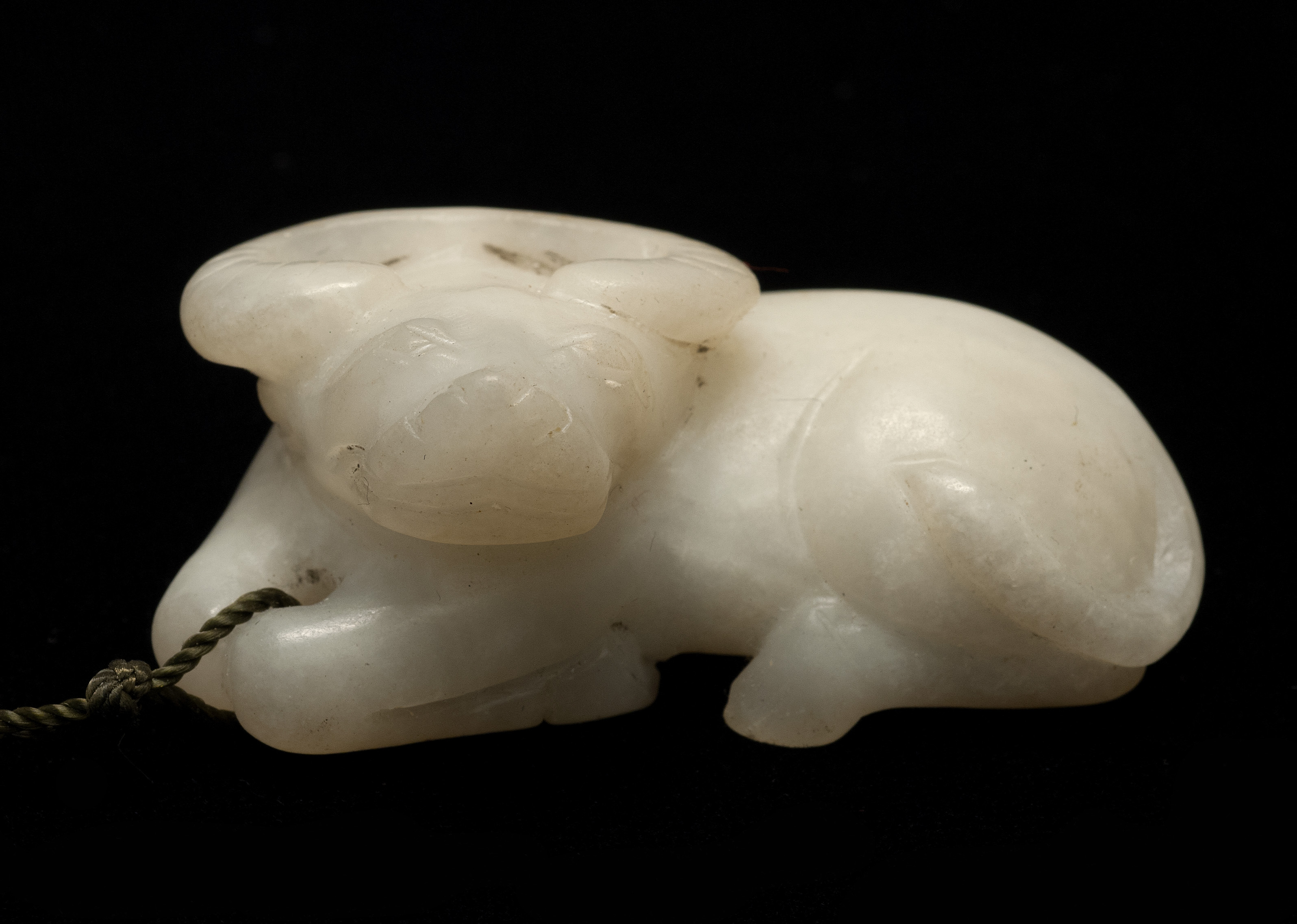 Appraisal: WHITE JADE CARVING In the form of a reclining water