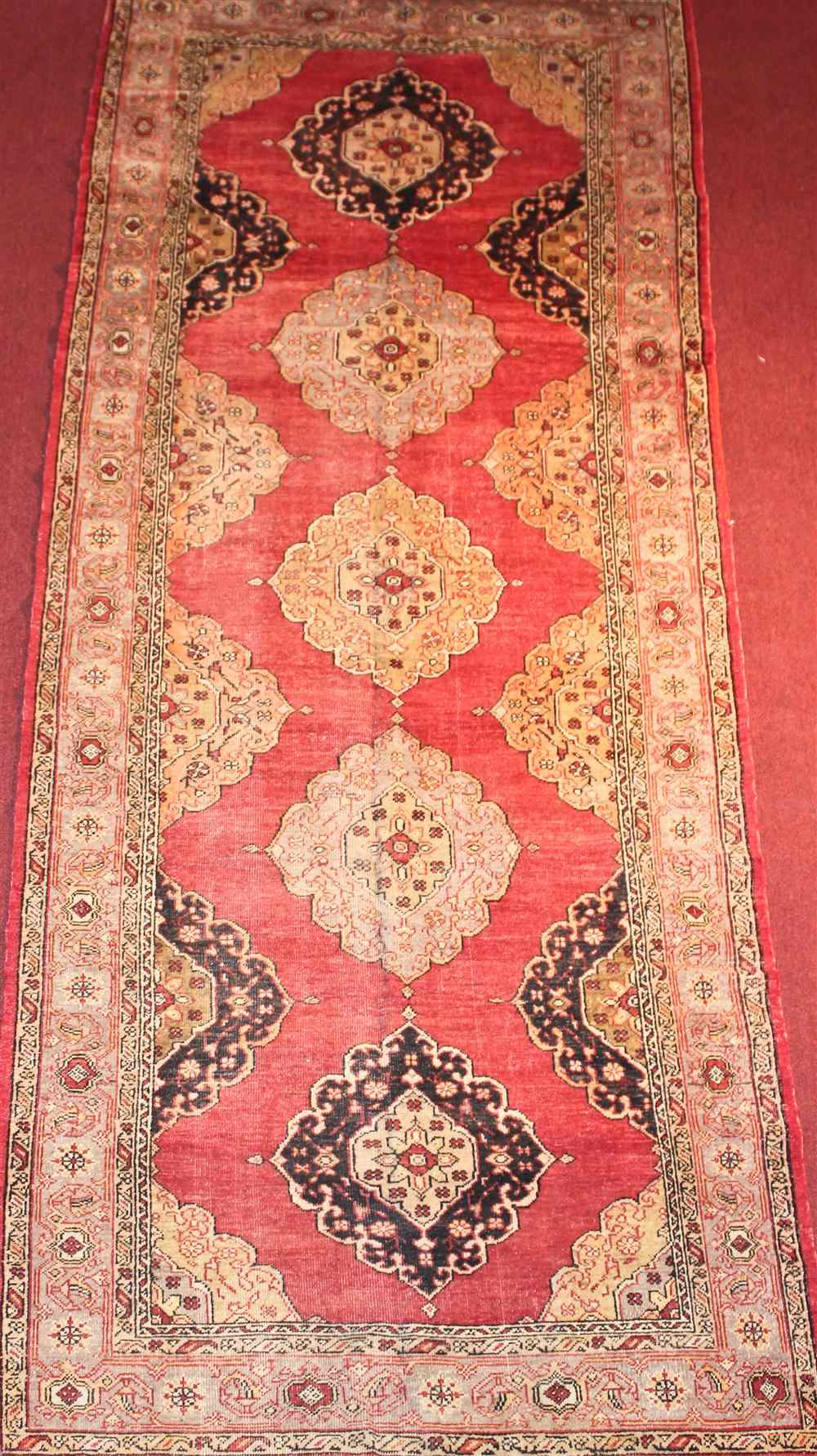 Appraisal: TURKISH RUG Approx ' x ' Retail tag Provenance From