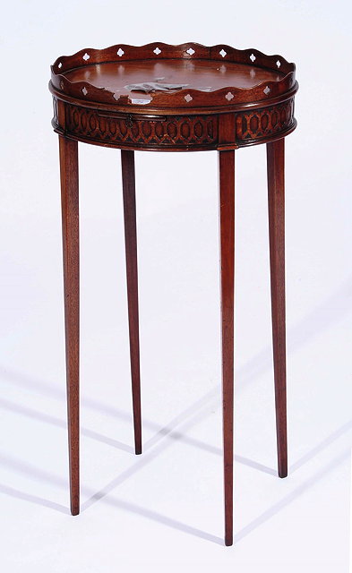 Appraisal: A CHIPPENDALE STYLE MAHOGANY URN STAND of oval form with