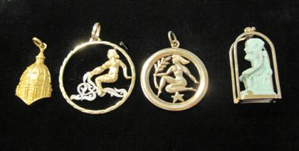 Appraisal: Group of four yellow gold charmsTwo karat and two karat