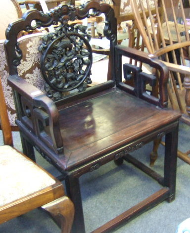 Appraisal: A Chinese rosewood open armchair circa with a cloud band