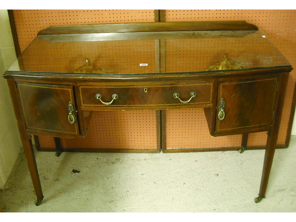 Appraisal: Edwardian mahogany bow fronted chevron banded desk dressing table the