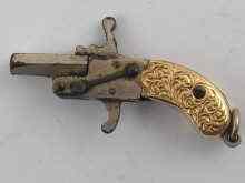 Appraisal: A miniature pistol with yellow metal tests carat gold mounted