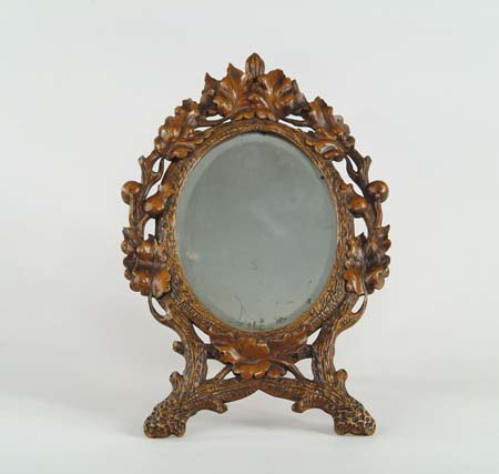 Appraisal: BLACK FOREST TYPE CARVED WALNUT DRESSING MIRROR Pierced carved with