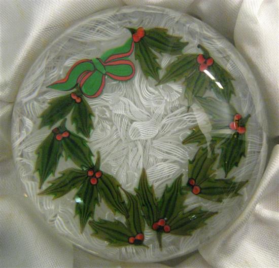 Appraisal: Perthshire glass Christmas paperweight containing a holly wreath with red