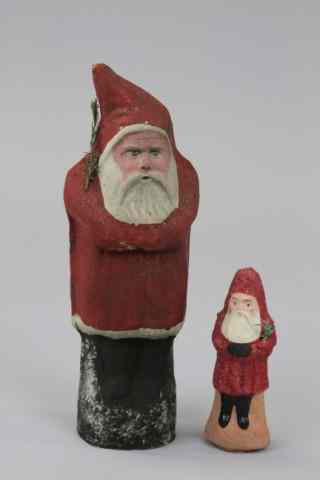 Appraisal: TWO GERMAN PRESSED CARDBOARD SANTAS Germany tall pressed cardboard Santa