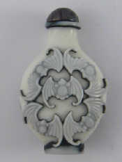 Appraisal: A double overlay white green on white snuff bottle with