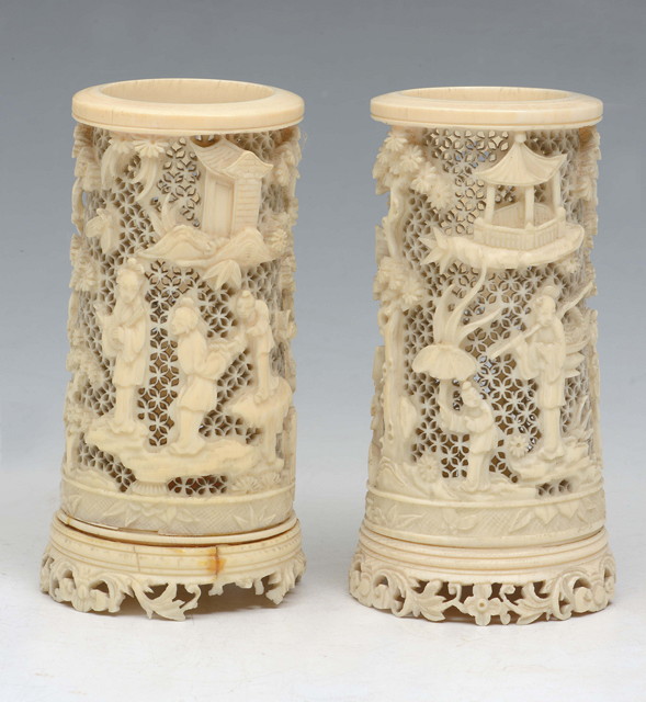 Appraisal: A PAIR OF CHINESE CANTON CARVED IVORY CYLINDRICAL SPILL HOLDERS