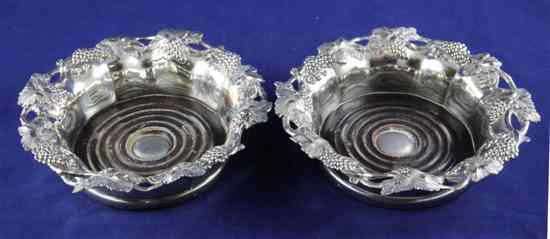 Appraisal: A pair of Victorian silver plated wine coasters with pierced