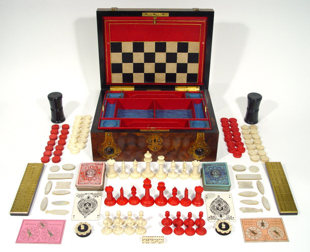 Appraisal: Victorian figured walnut games box with brass banding and cat's