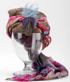 Appraisal: Turban of a Magician's Assistan Turban of a Magician s