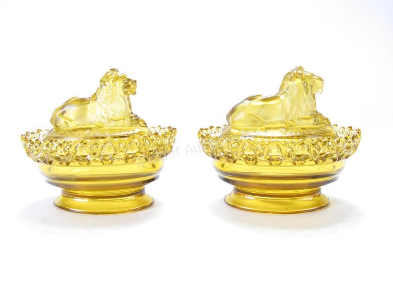 Appraisal: Pair of Imperial Amber Glass Lion Lidded Candy Dishes frosted