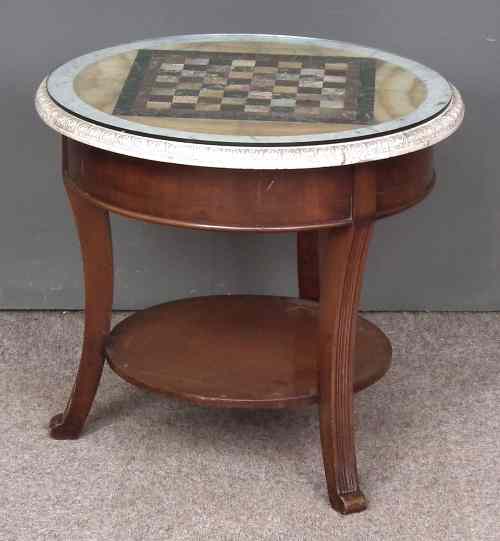 Appraisal: A specimen marble table top the top inlaid with a